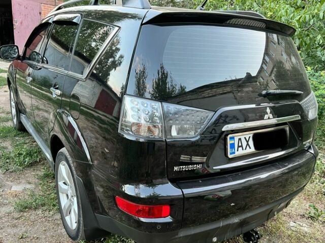 Черный Мицубиси Аутлендер, объемом двигателя 2.4 л и пробегом 220 тыс. км за 10500 $, фото 3 на Automoto.ua