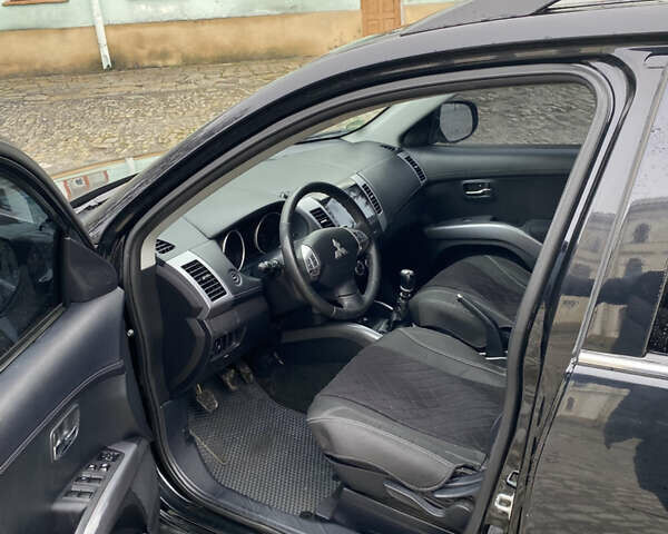 Черный Мицубиси Аутлендер, объемом двигателя 2.27 л и пробегом 233 тыс. км за 10500 $, фото 9 на Automoto.ua