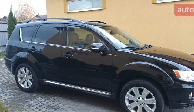Черный Мицубиси Аутлендер, объемом двигателя 2.2 л и пробегом 209 тыс. км за 12700 $, фото 4 на Automoto.ua