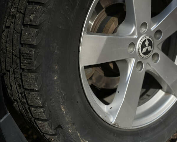 Міцубісі Аутлендер 2011 у Хмельницькому на Automoto.ua Чорний Міцубісі Аутлендер, об'ємом двигуна 2 л та пробігом 196 тис. км за 9500 $, фото 13 на Automoto.ua