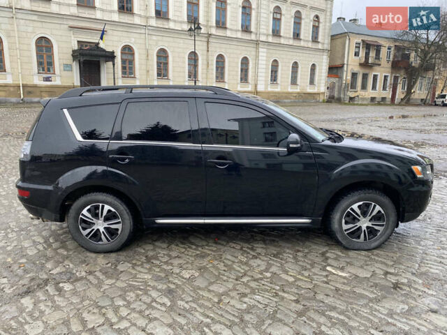 Черный Мицубиси Аутлендер, объемом двигателя 2.27 л и пробегом 233 тыс. км за 10500 $, фото 5 на Automoto.ua