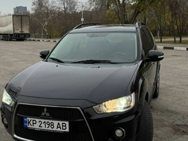 Черный Мицубиси Аутлендер, объемом двигателя 2.2 л и пробегом 253 тыс. км за 12500 $, фото 1 на Automoto.ua