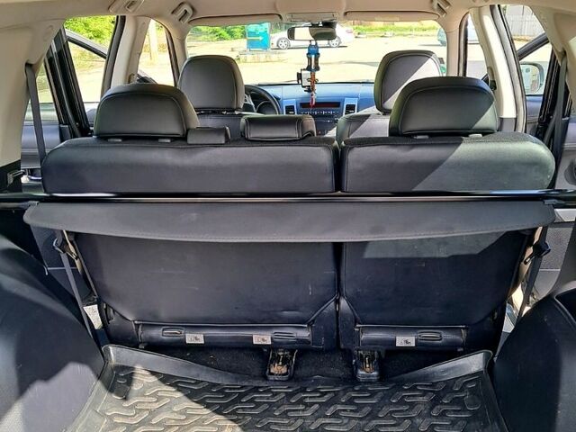 Мицубиси Аутлендер 2011 в Ивано-Франковске на Automoto.ua Черный Мицубиси Аутлендер, объемом двигателя 2.2 л и пробегом 192 тыс. км за 11000 $, фото 7 на Automoto.ua