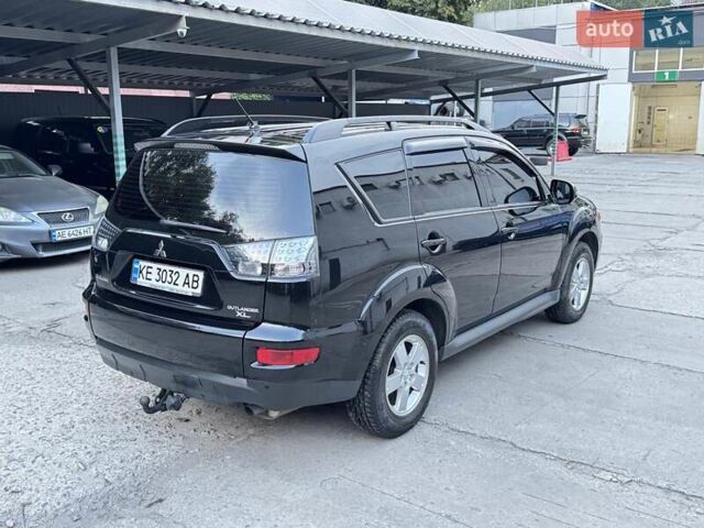 Черный Мицубиси Аутлендер, объемом двигателя 2 л и пробегом 150 тыс. км за 10200 $, фото 2 на Automoto.ua