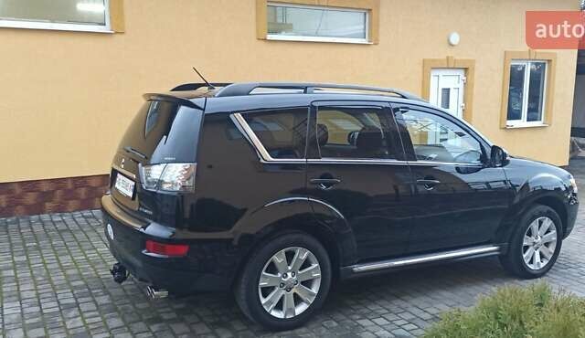 Черный Мицубиси Аутлендер, объемом двигателя 2.2 л и пробегом 209 тыс. км за 12700 $, фото 3 на Automoto.ua