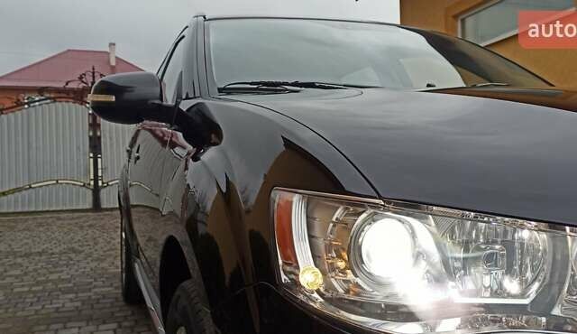 Черный Мицубиси Аутлендер, объемом двигателя 2.2 л и пробегом 209 тыс. км за 12700 $, фото 2 на Automoto.ua