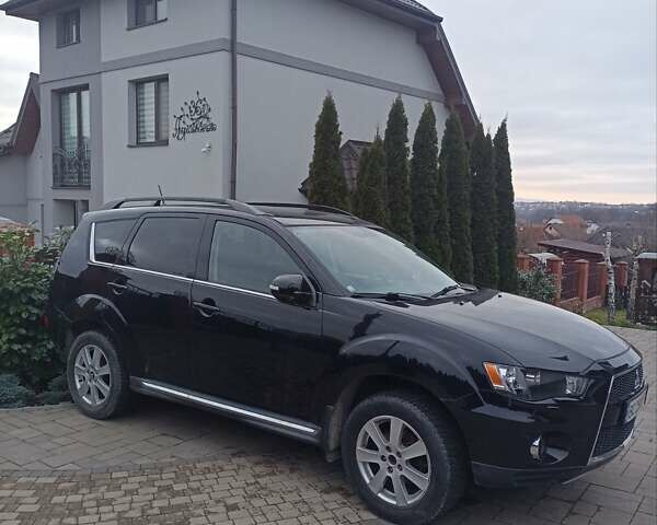 Черный Мицубиси Аутлендер, объемом двигателя 2 л и пробегом 196 тыс. км за 9900 $, фото 7 на Automoto.ua