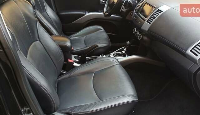 Черный Мицубиси Аутлендер, объемом двигателя 2.2 л и пробегом 209 тыс. км за 12700 $, фото 35 на Automoto.ua