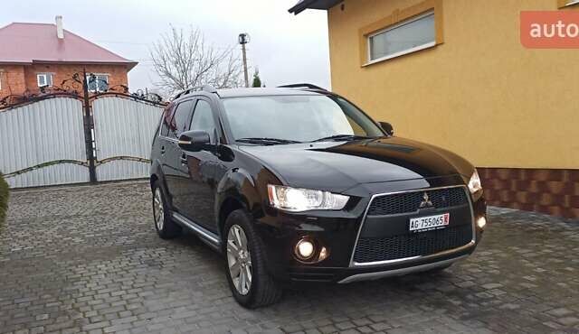Черный Мицубиси Аутлендер, объемом двигателя 2.2 л и пробегом 209 тыс. км за 12700 $, фото 5 на Automoto.ua
