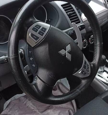 Черный Мицубиси Аутлендер, объемом двигателя 2 л и пробегом 196 тыс. км за 9900 $, фото 19 на Automoto.ua