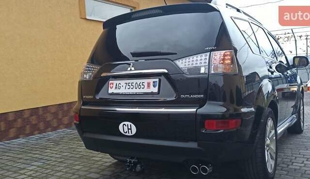 Черный Мицубиси Аутлендер, объемом двигателя 2.2 л и пробегом 209 тыс. км за 12700 $, фото 1 на Automoto.ua