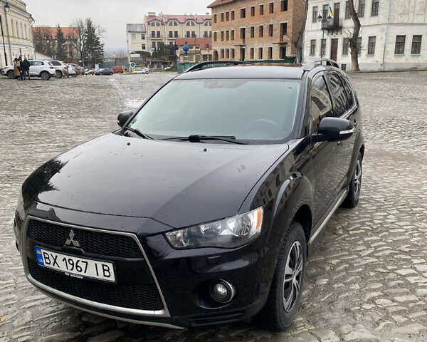 Черный Мицубиси Аутлендер, объемом двигателя 2.27 л и пробегом 233 тыс. км за 10500 $, фото 1 на Automoto.ua