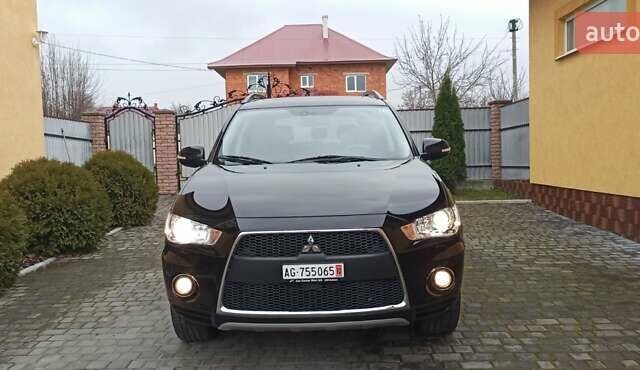 Черный Мицубиси Аутлендер, объемом двигателя 2.2 л и пробегом 209 тыс. км за 12700 $, фото 9 на Automoto.ua