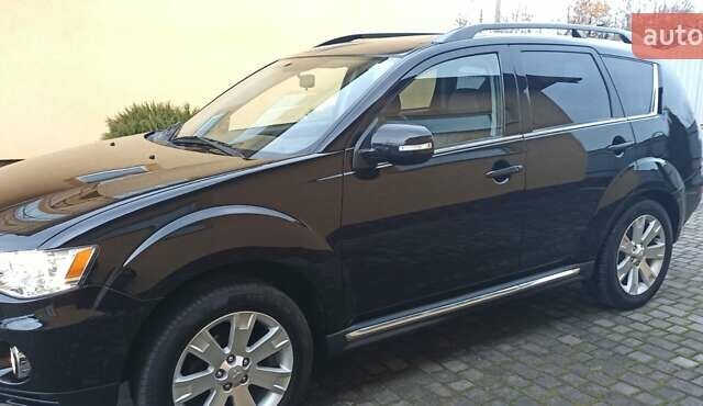 Черный Мицубиси Аутлендер, объемом двигателя 2.2 л и пробегом 209 тыс. км за 12700 $, фото 15 на Automoto.ua