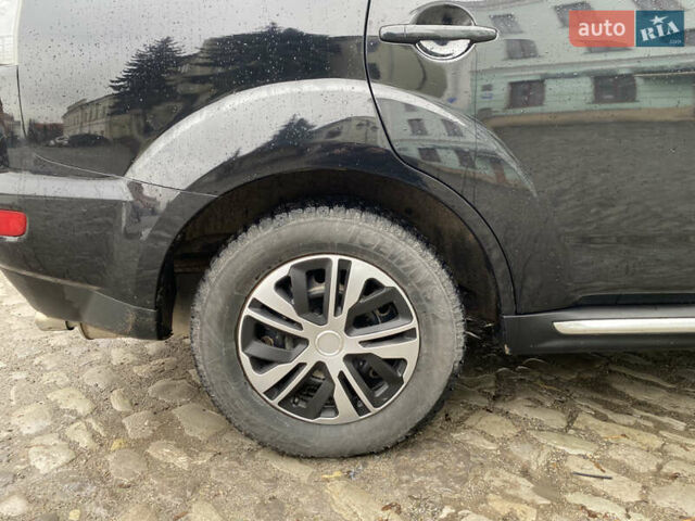 Черный Мицубиси Аутлендер, объемом двигателя 2.27 л и пробегом 233 тыс. км за 10500 $, фото 16 на Automoto.ua