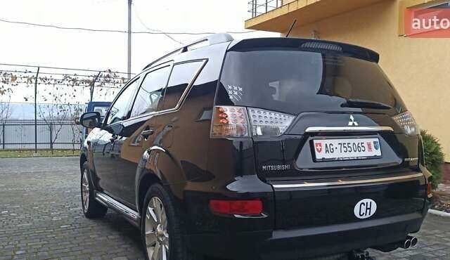 Черный Мицубиси Аутлендер, объемом двигателя 2.2 л и пробегом 209 тыс. км за 12700 $, фото 11 на Automoto.ua