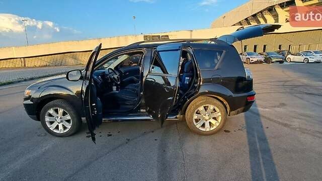 Черный Мицубиси Аутлендер, объемом двигателя 2.36 л и пробегом 285 тыс. км за 11300 $, фото 35 на Automoto.ua