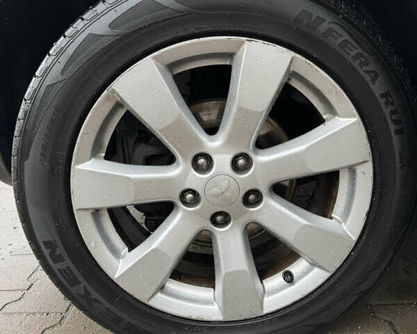 Чорний Міцубісі Аутлендер, об'ємом двигуна 2.36 л та пробігом 96 тис. км за 11700 $, фото 10 на Automoto.ua