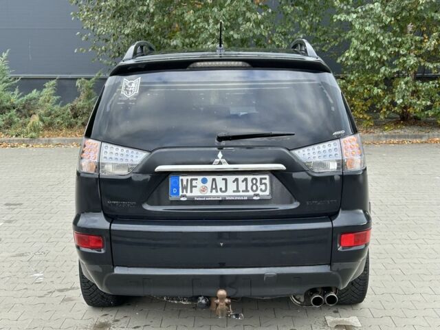 Черный Мицубиси Аутлендер, объемом двигателя 2 л и пробегом 250 тыс. км за 4850 $, фото 3 на Automoto.ua