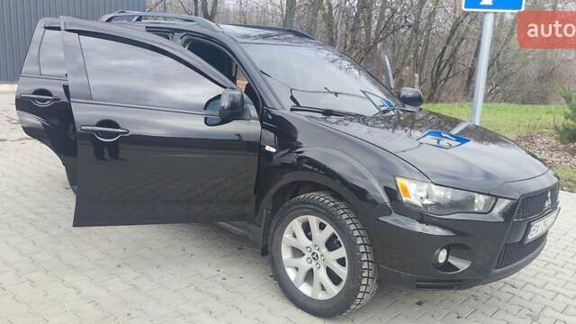 Чорний Міцубісі Аутлендер, об'ємом двигуна 2.36 л та пробігом 137 тис. км за 11200 $, фото 13 на Automoto.ua