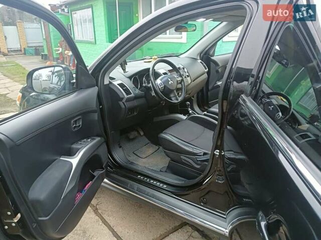 Черный Мицубиси Аутлендер, объемом двигателя 2.2 л и пробегом 218 тыс. км за 11500 $, фото 17 на Automoto.ua