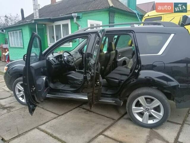 Черный Мицубиси Аутлендер, объемом двигателя 2.2 л и пробегом 218 тыс. км за 11500 $, фото 18 на Automoto.ua