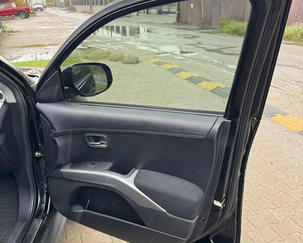 Чорний Міцубісі Аутлендер, об'ємом двигуна 2.36 л та пробігом 96 тис. км за 11700 $, фото 33 на Automoto.ua