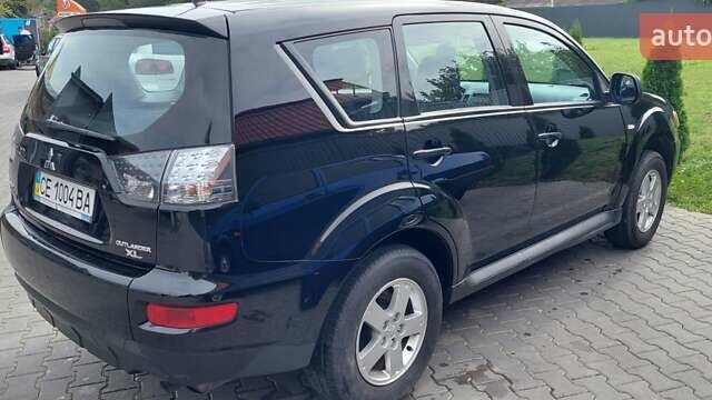 Чорний Міцубісі Аутлендер, об'ємом двигуна 2 л та пробігом 101 тис. км за 10300 $, фото 9 на Automoto.ua