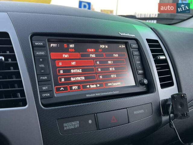 Чорний Міцубісі Аутлендер, об'ємом двигуна 2.3 л та пробігом 124 тис. км за 11999 $, фото 59 на Automoto.ua