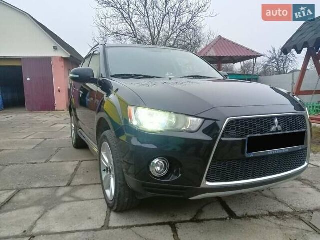 Черный Мицубиси Аутлендер, объемом двигателя 2.2 л и пробегом 218 тыс. км за 11500 $, фото 2 на Automoto.ua