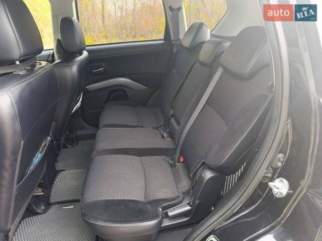 Черный Мицубиси Аутлендер, объемом двигателя 2.2 л и пробегом 218 тыс. км за 11800 $, фото 1 на Automoto.ua