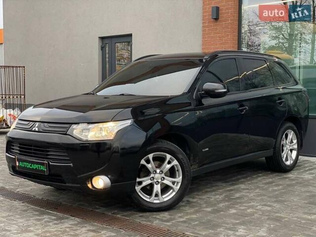 Черный Мицубиси Аутлендер, объемом двигателя 2.36 л и пробегом 212 тыс. км за 12990 $, фото 1 на Automoto.ua