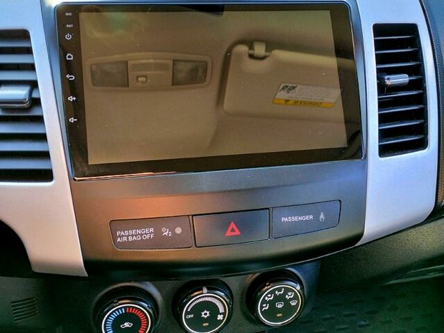 Черный Мицубиси Аутлендер, объемом двигателя 2.4 л и пробегом 140 тыс. км за 10500 $, фото 7 на Automoto.ua