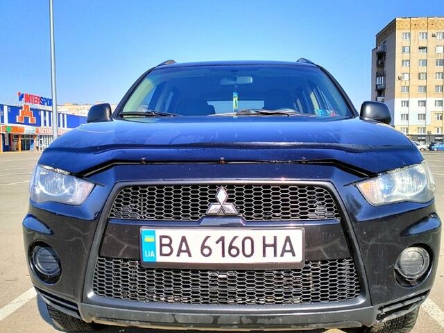 Черный Мицубиси Аутлендер, объемом двигателя 2.4 л и пробегом 140 тыс. км за 10500 $, фото 1 на Automoto.ua