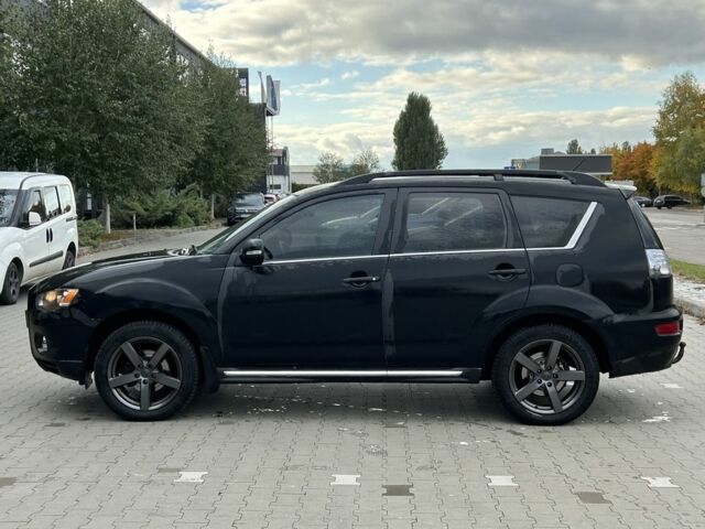 Черный Мицубиси Аутлендер, объемом двигателя 2 л и пробегом 250 тыс. км за 4850 $, фото 1 на Automoto.ua