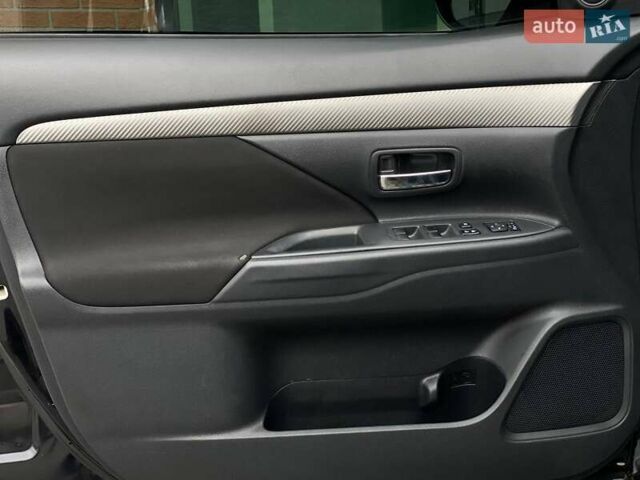 Черный Мицубиси Аутлендер, объемом двигателя 2.36 л и пробегом 212 тыс. км за 12990 $, фото 16 на Automoto.ua