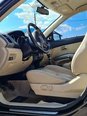 Черный Мицубиси Аутлендер, объемом двигателя 2.27 л и пробегом 195 тыс. км за 10500 $, фото 24 на Automoto.ua