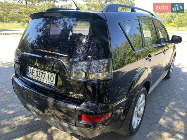 Черный Мицубиси Аутлендер, объемом двигателя 2.36 л и пробегом 155 тыс. км за 9000 $, фото 3 на Automoto.ua