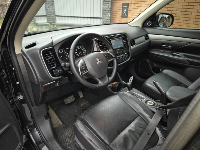 Черный Мицубиси Аутлендер, объемом двигателя 2.4 л и пробегом 211 тыс. км за 12590 $, фото 11 на Automoto.ua