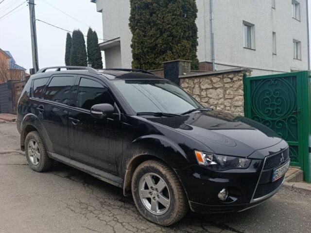 Черный Мицубиси Аутлендер, объемом двигателя 2 л и пробегом 235 тыс. км за 10300 $, фото 1 на Automoto.ua