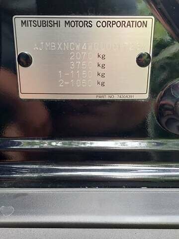 Чорний Міцубісі Аутлендер, об'ємом двигуна 2 л та пробігом 101 тис. км за 10300 $, фото 22 на Automoto.ua