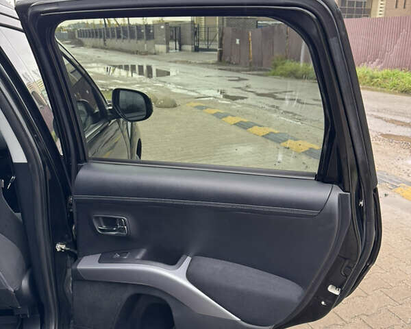 Чорний Міцубісі Аутлендер, об'ємом двигуна 2.36 л та пробігом 96 тис. км за 11700 $, фото 28 на Automoto.ua