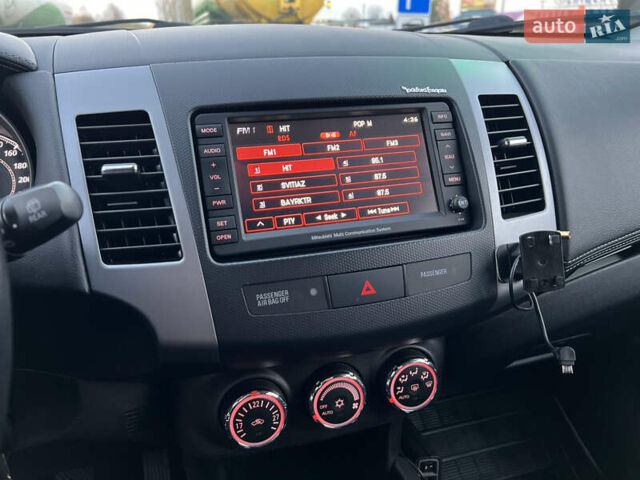 Чорний Міцубісі Аутлендер, об'ємом двигуна 2.3 л та пробігом 124 тис. км за 11999 $, фото 56 на Automoto.ua