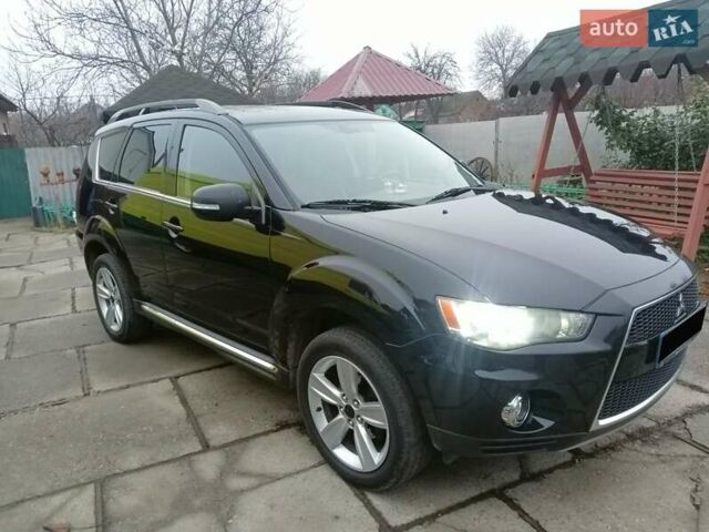 Черный Мицубиси Аутлендер, объемом двигателя 2.2 л и пробегом 218 тыс. км за 11500 $, фото 1 на Automoto.ua