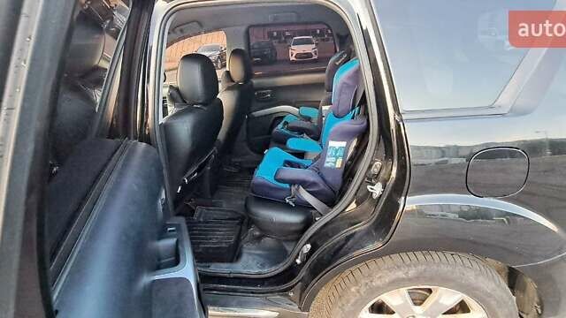 Черный Мицубиси Аутлендер, объемом двигателя 2.36 л и пробегом 285 тыс. км за 11300 $, фото 15 на Automoto.ua