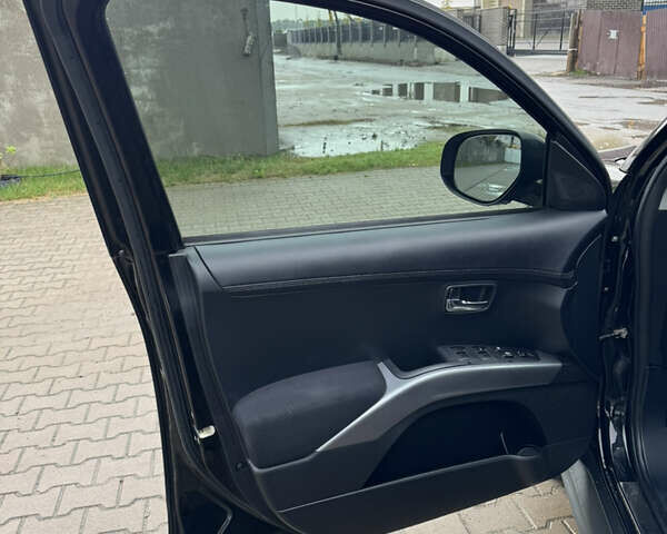 Чорний Міцубісі Аутлендер, об'ємом двигуна 2.36 л та пробігом 96 тис. км за 11700 $, фото 23 на Automoto.ua