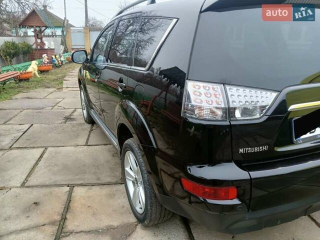 Черный Мицубиси Аутлендер, объемом двигателя 2.2 л и пробегом 218 тыс. км за 11500 $, фото 6 на Automoto.ua