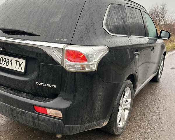 Черный Мицубиси Аутлендер, объемом двигателя 2.27 л и пробегом 202 тыс. км за 13100 $, фото 2 на Automoto.ua