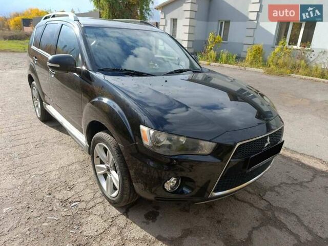 Черный Мицубиси Аутлендер, объемом двигателя 2.2 л и пробегом 218 тыс. км за 11800 $, фото 3 на Automoto.ua