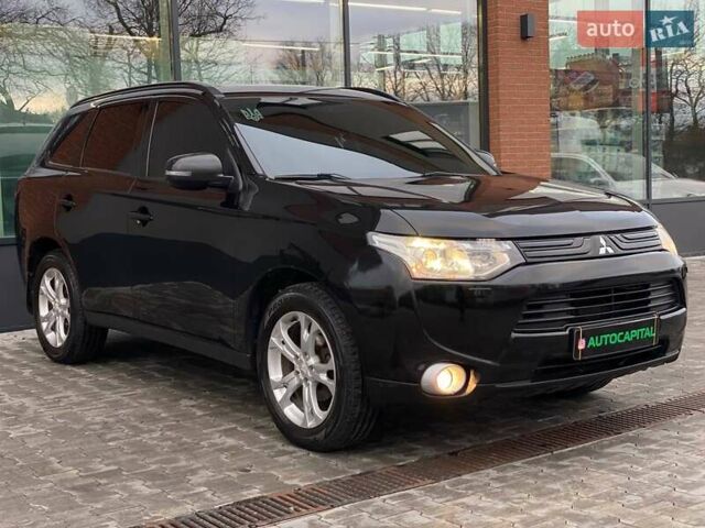Черный Мицубиси Аутлендер, объемом двигателя 2.36 л и пробегом 212 тыс. км за 12990 $, фото 2 на Automoto.ua